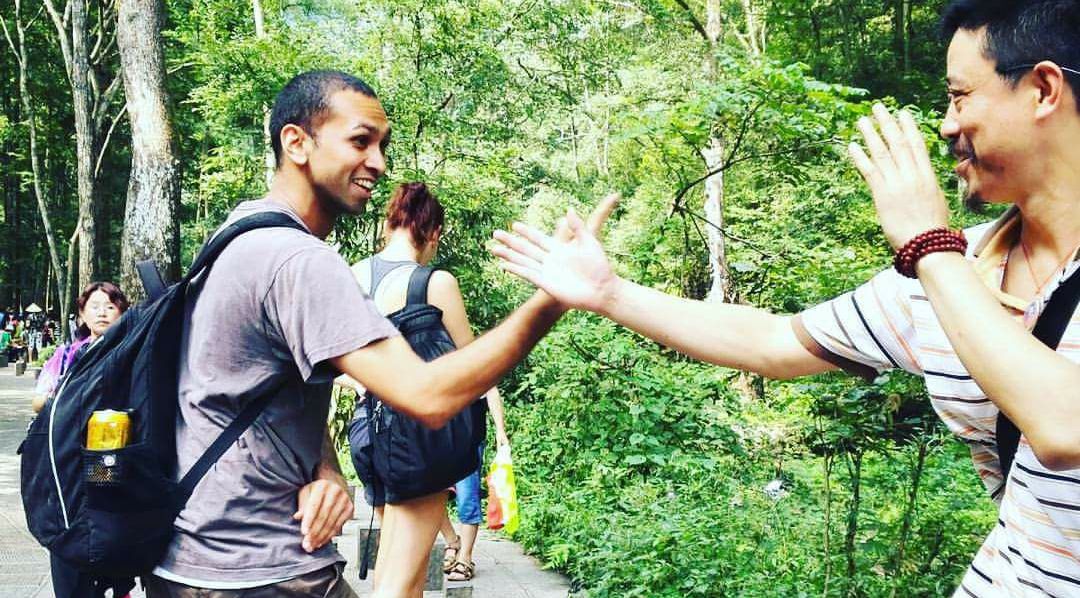 A photo of Aamir doing pushhands in a park